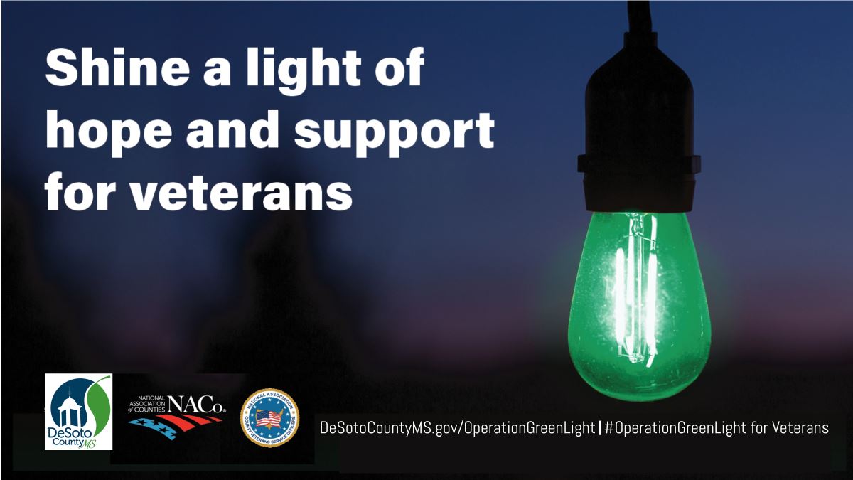 Green light bulb outside of house Opens in new window